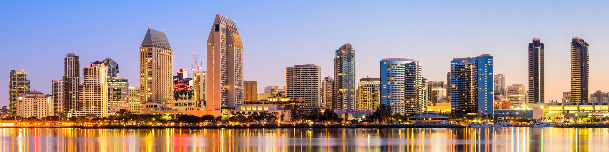 Skyline of the city as dusk with the city lights reflecting on the water