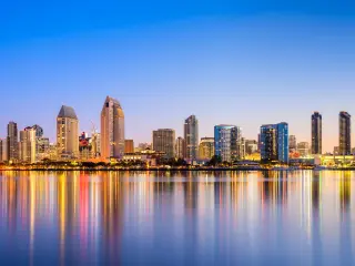 Skyline of the city as dusk with the city lights reflecting on the water