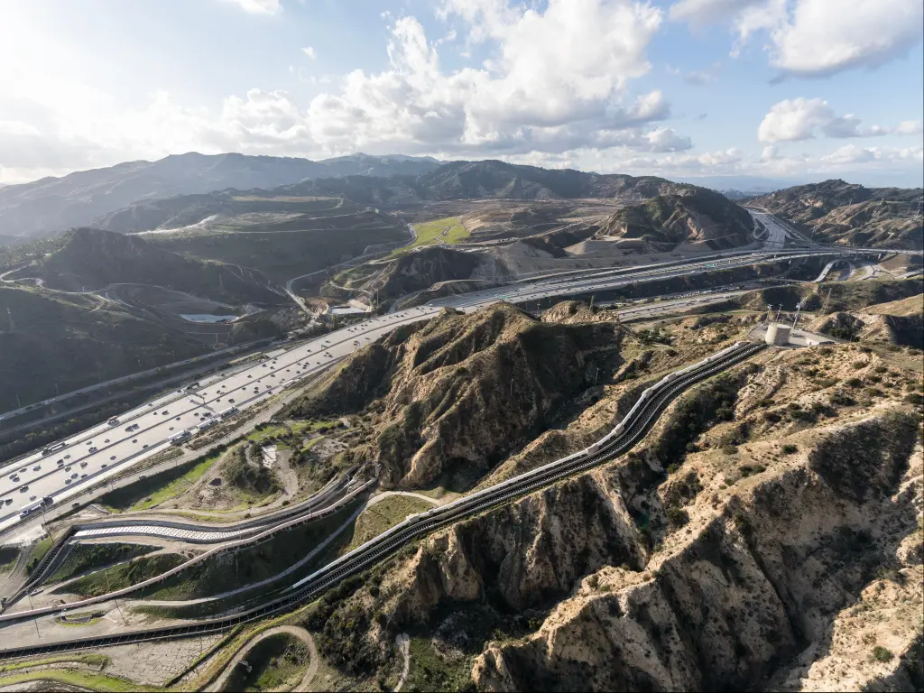Aerial view of I-5 in California and other connecting roads, winding through the hills outside Santa Clarita