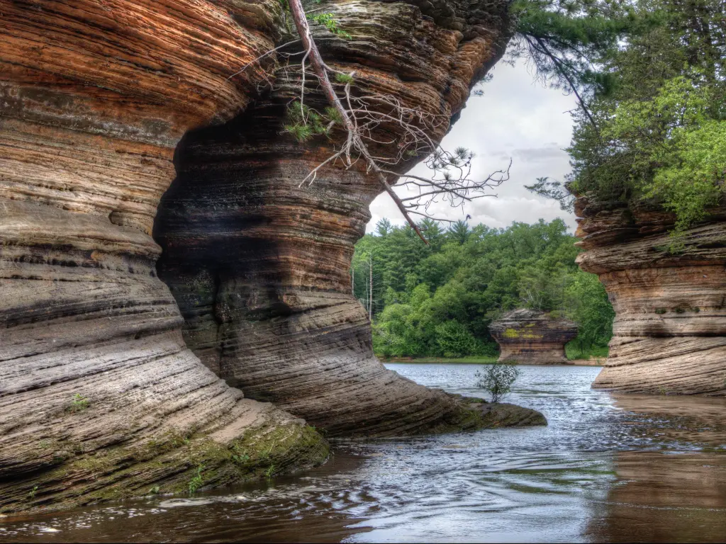 Witches Gulch, Wisconsin Dells, USA with impressive cliff edges and trees in the distance, river in the foreground. 