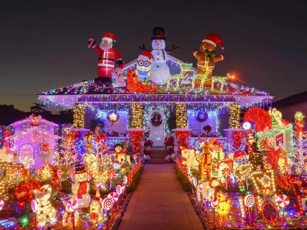 An American-style house covered in Christmas lights and decorations