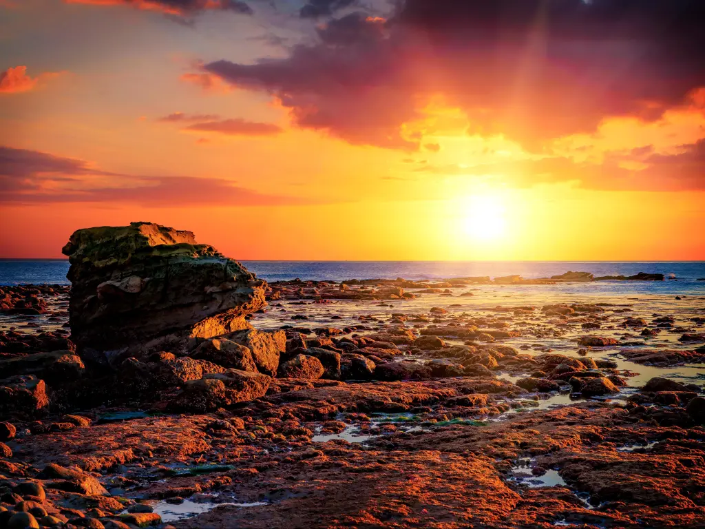 Sunset at Bird Rock, La Jolla, San Diego, California in vibrant hues at low tide.