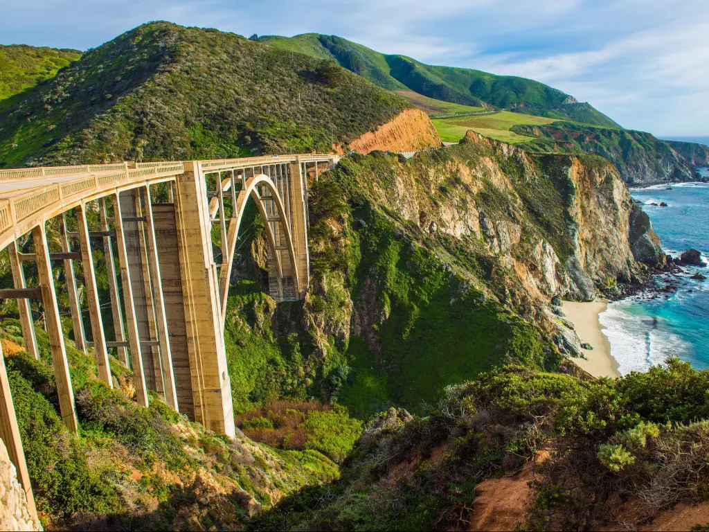 View over the Bixby Creek Bridge in Big Sur, California on a sunny day with the ocean below