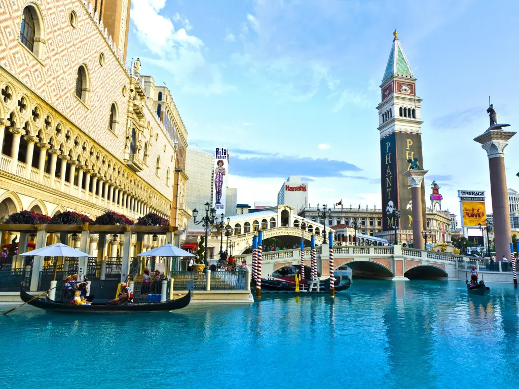 The Venetian-style pool in the resort with a replica of Rialto Bridge in the background
