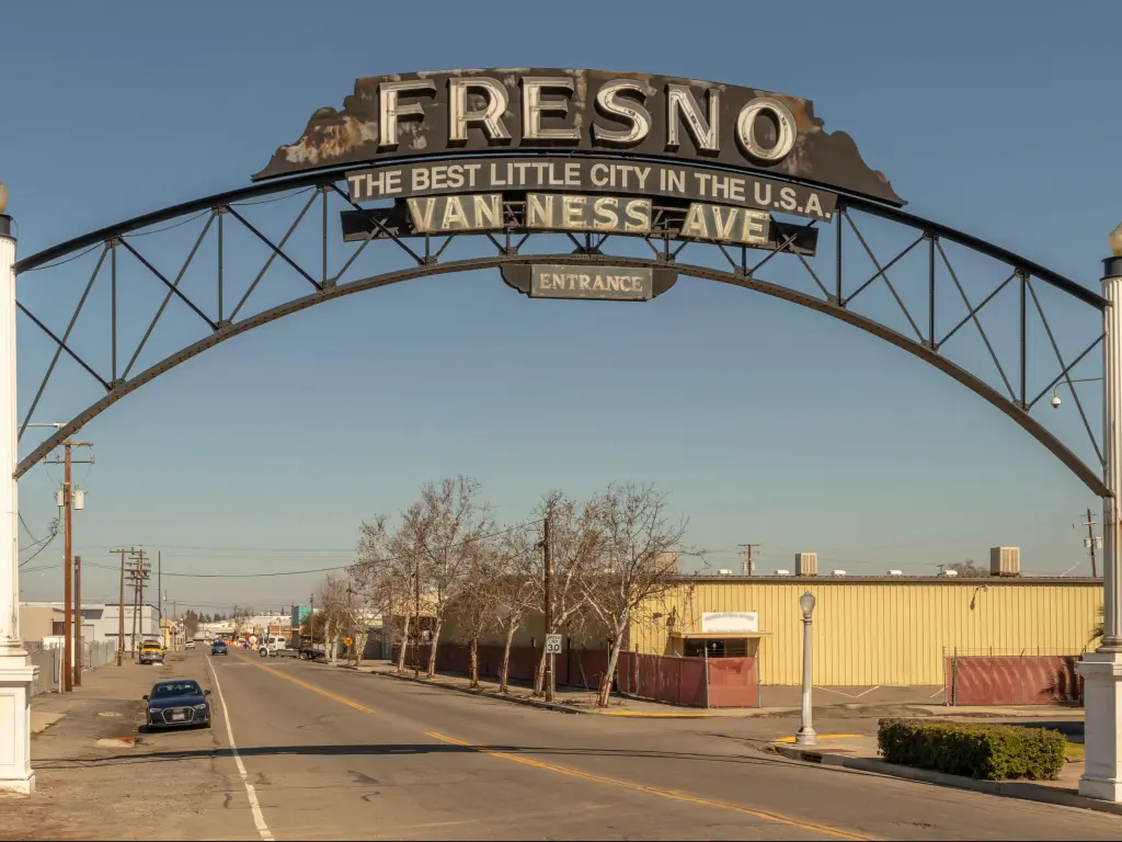 Fresno city welcome sign arch over the road at, Van Ness Ave. Sign reads "The Best Little City in the USA"