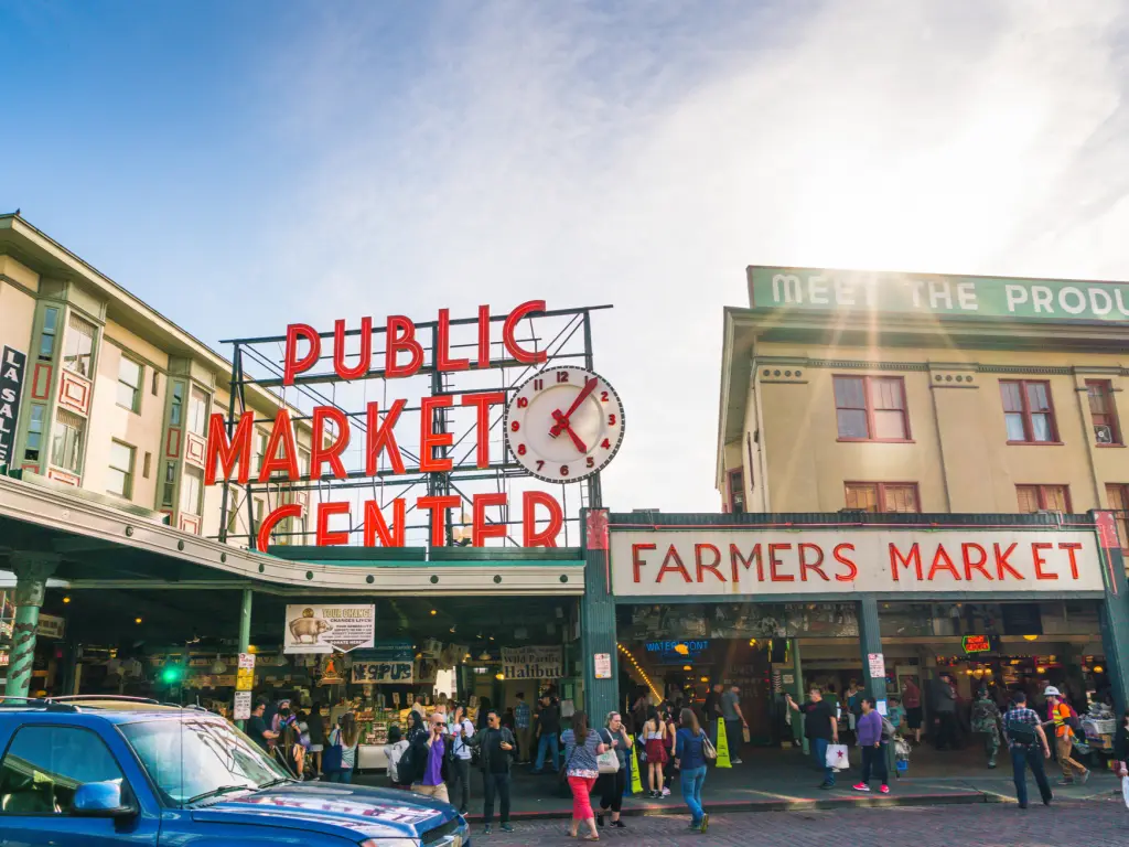 People visit the popular Pike Place Market in Seattle on a sunny day