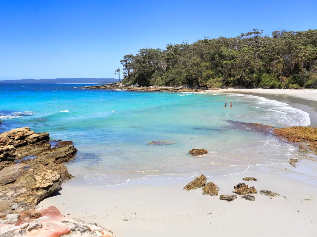 Blenheim Beach's white sands and turquoise waters on a sunny day