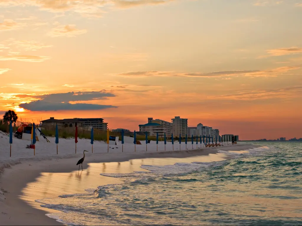 Sunrise at the beach in Destin, Florida, with hotel buildings facing the Atlantic coastline