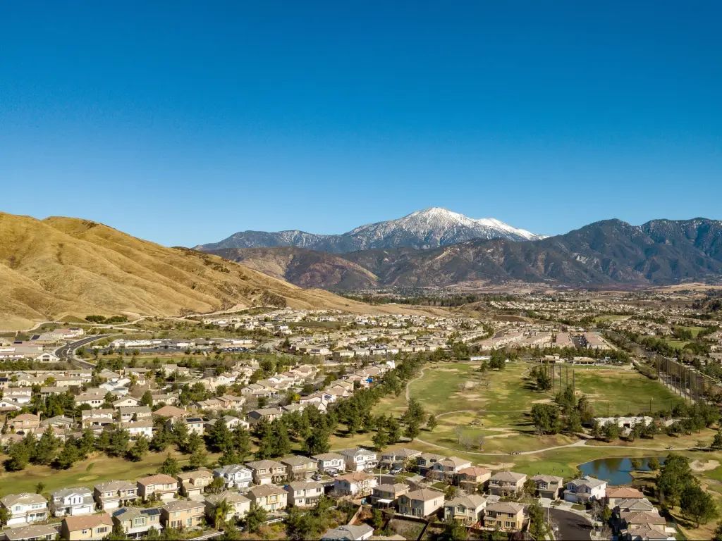 San Bernardino Mountains, Southern California, USA with snow capped Mount San Gorgonio above Yucaipa Valley Golf Course.