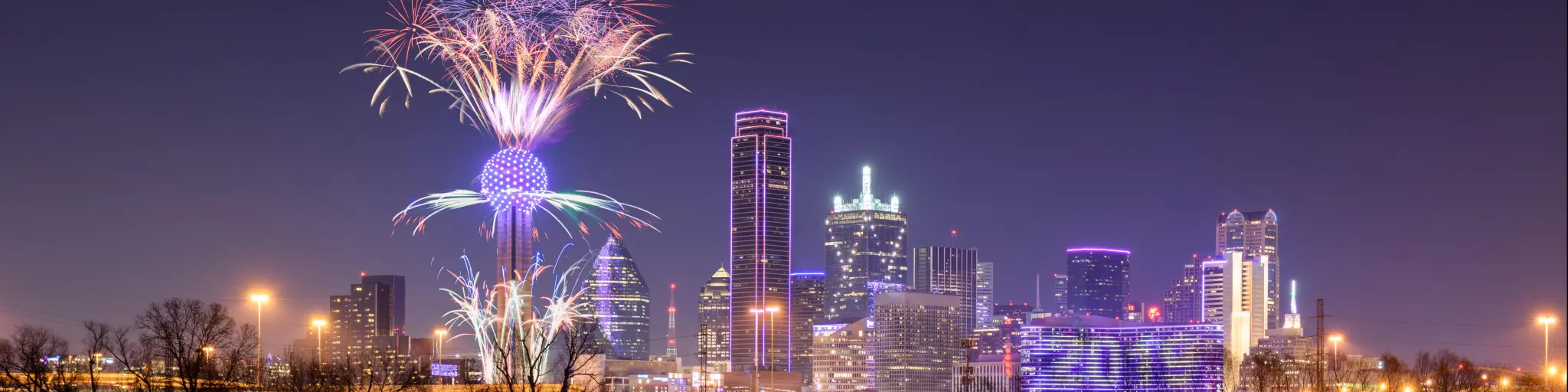 Fireworks at Reunion Tower, Dallas during new year's celebrations at night.