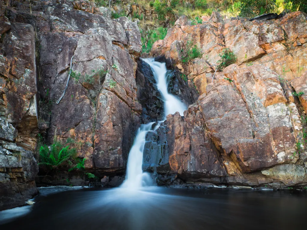 Beautiful waterfall in Grampians National Park, flowing through a rock cliff