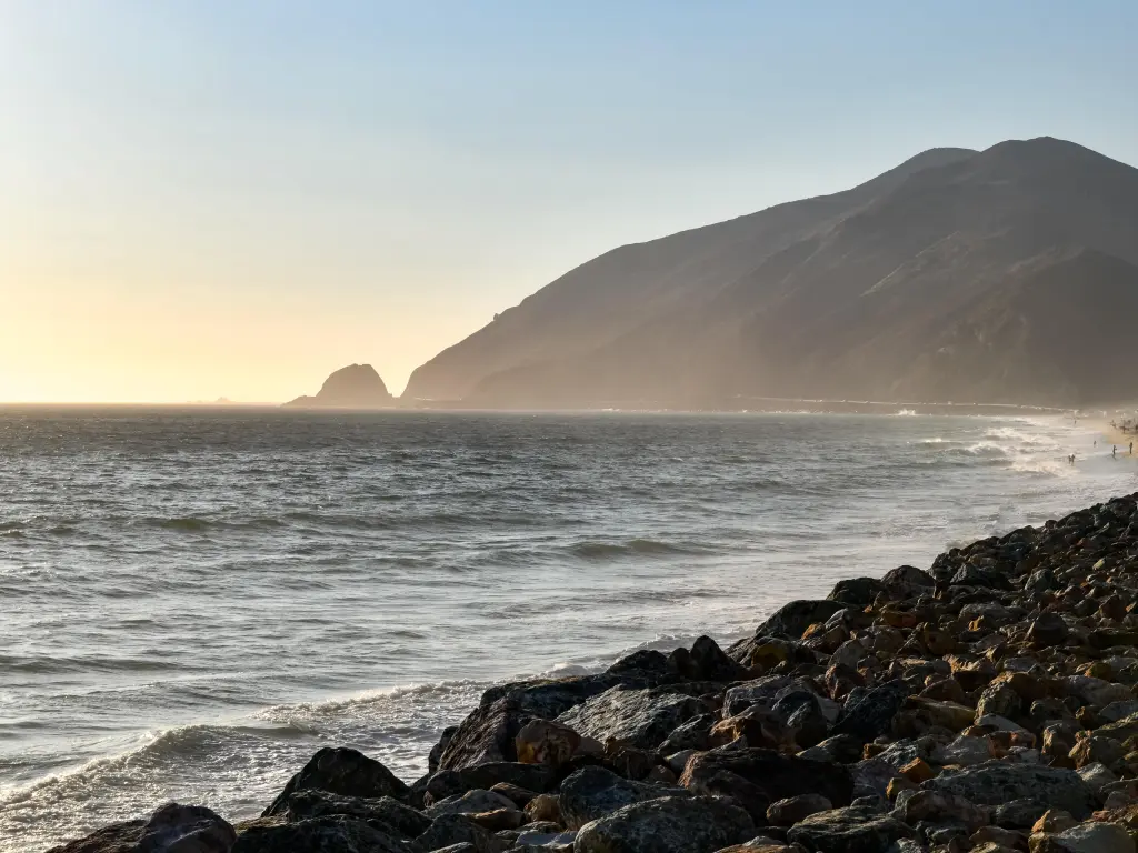 Beautiful view of a cove and hills during sunrise