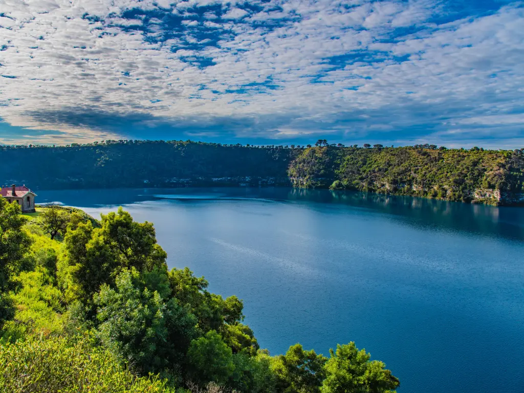 Beautiful dark blue lake in Mount Gambier on a partially cloudy day