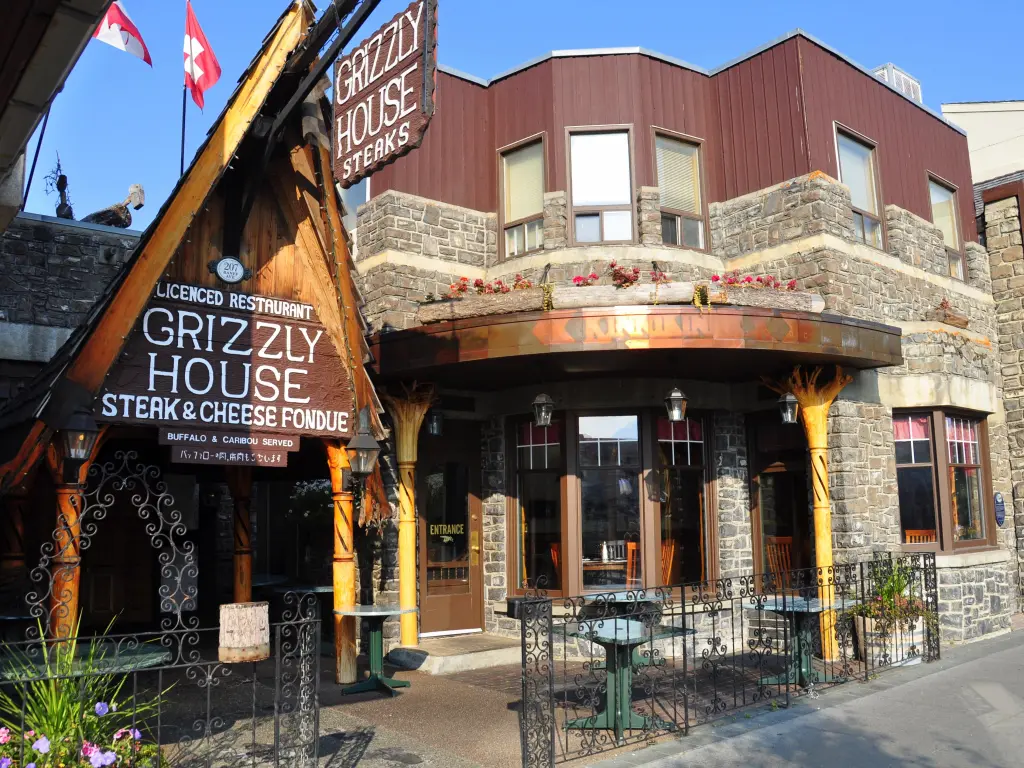 Exterior of famous steak and cheese fondue restaurant in Banff on a sunny day