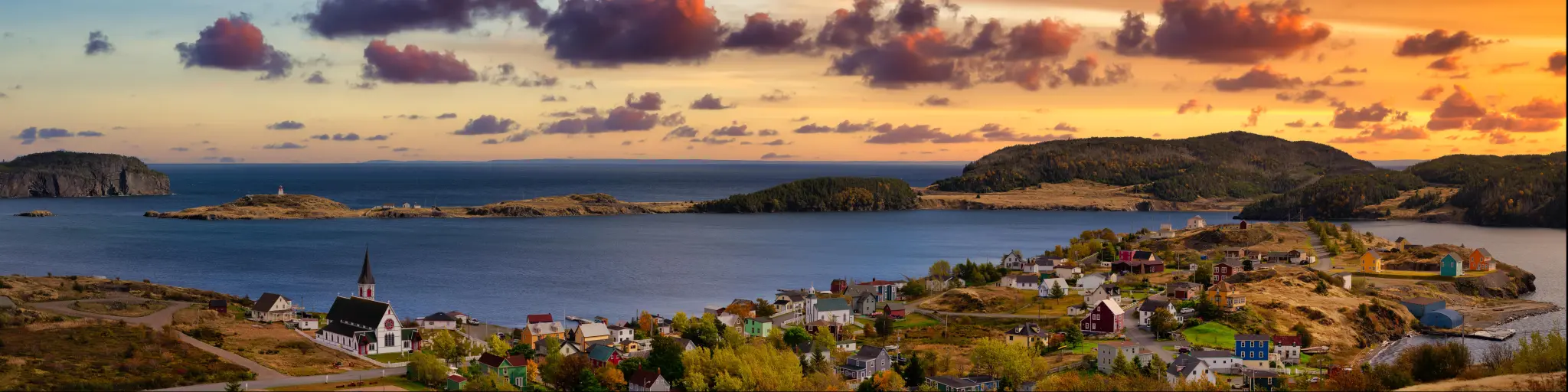 Aerial view of a small town on the coast of Newfoundland, near Trinity, at twilight