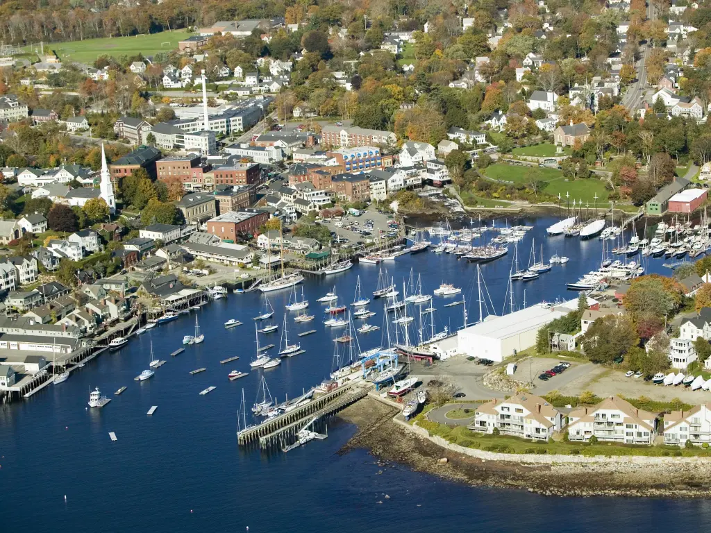 Marina with boats docked in the bay on a autumn day